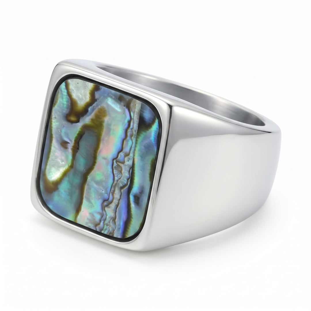Abalone Shell Signet Ring close up at an angle, lying on its side