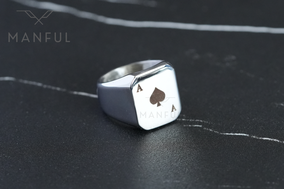 Ace Of Spades Signet Ring, resting on a dark marble surface with Manful branding visible