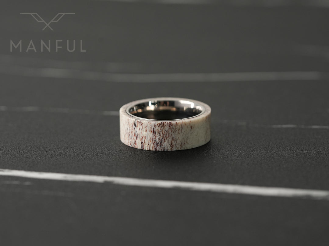 Antler & Titanium Band, standing front-on against a dark marble surface
