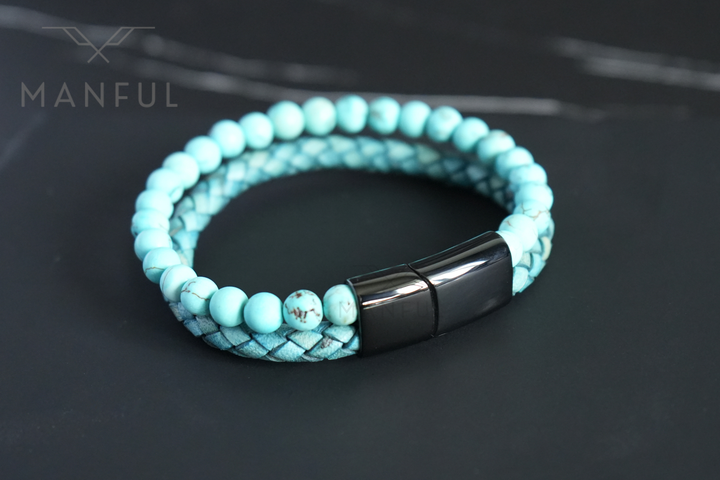 Aqua Bead And Leather Bracelet, close-up on dark marble with the black magnetic clasp in focus