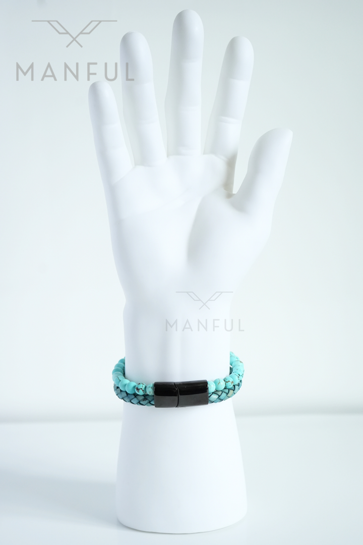 Aqua Bead And Leather Bracelet, close-up on a mannequin wrist with fingers spread above it