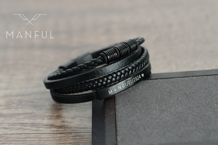 Black Leather Bracelet, close-up on an angular stone block showing a custom date engraving