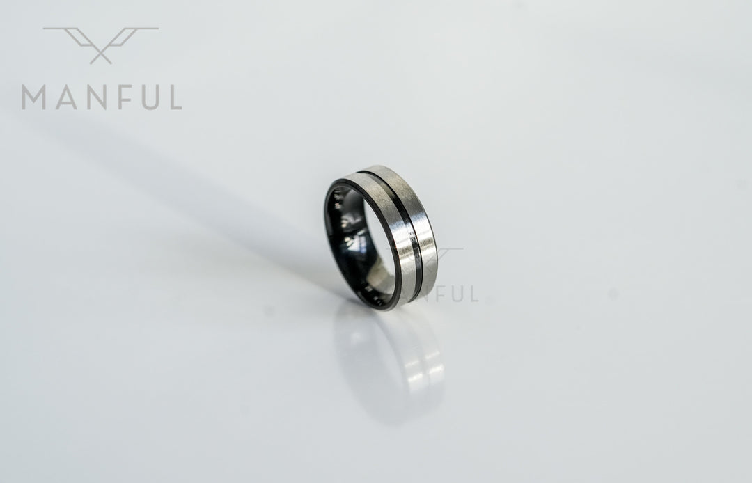 Black Onyx and Silver Band, isolated on a white background at an angle showing the silver centre line