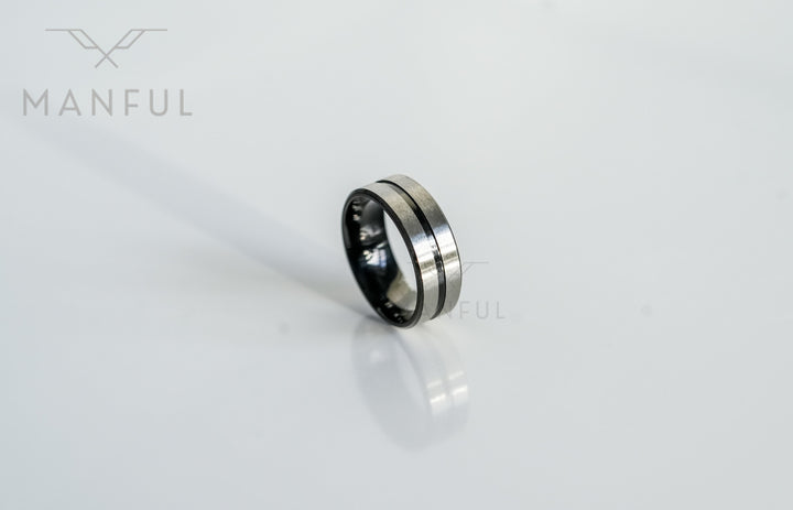 Black Onyx and Silver Band, isolated on a white background at an angle showing the silver centre line