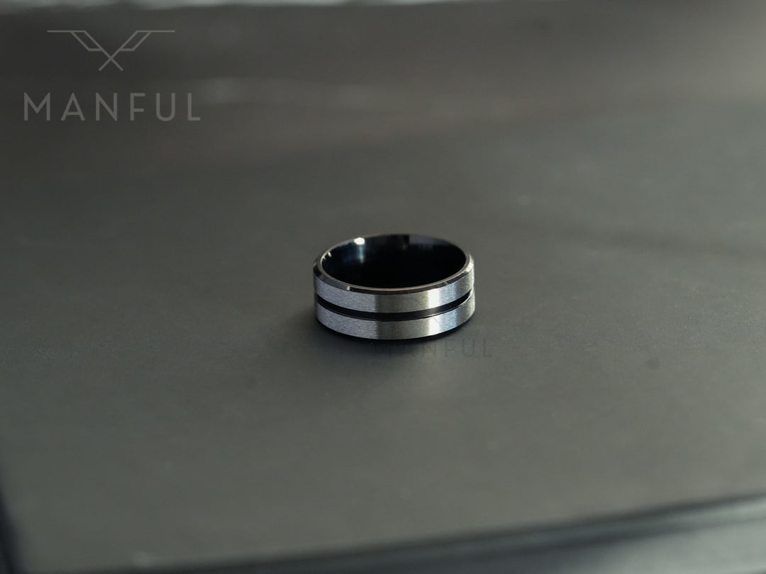 Black Onyx and Silver Band, standing upright on a dark marble surface with the double silver line visible