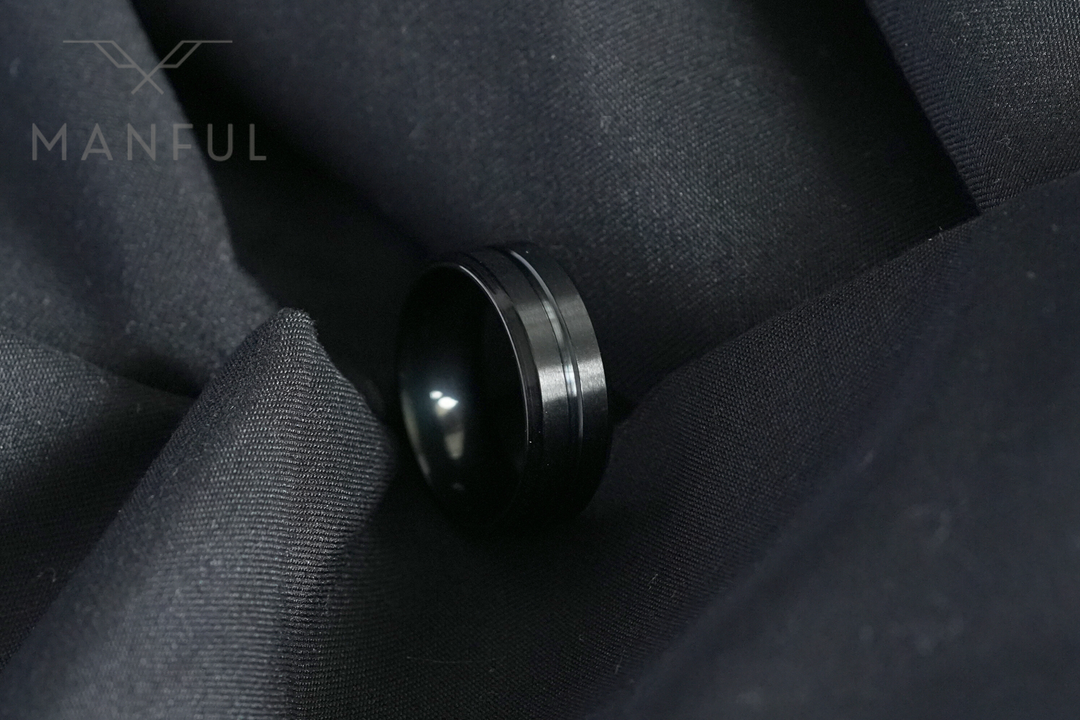 Black Onyx Band, nestled in the folds of black fabric for a moody close-up shot