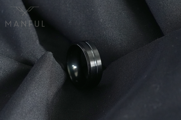 Black Onyx Band, nestled in the folds of black fabric for a moody close-up shot