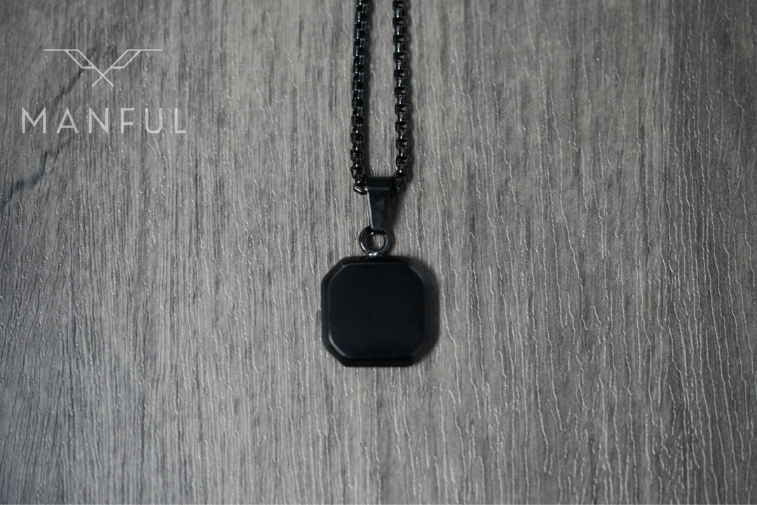 Onyx Square Necklace Black, flat lay on a wood surface, pulled back to show more chain
