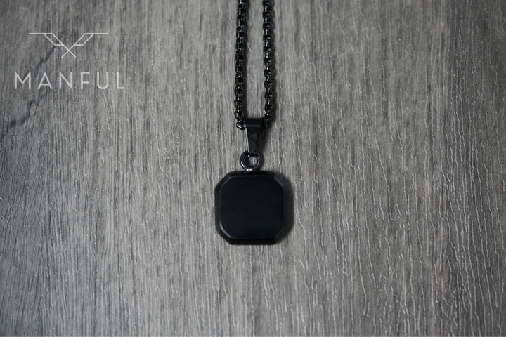 Onyx Square Necklace Black, flat lay on a wood surface, pulled back to show more chain
