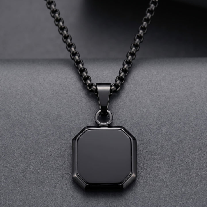 Onyx Square Necklace (Black) against a dark charcoal backdrop