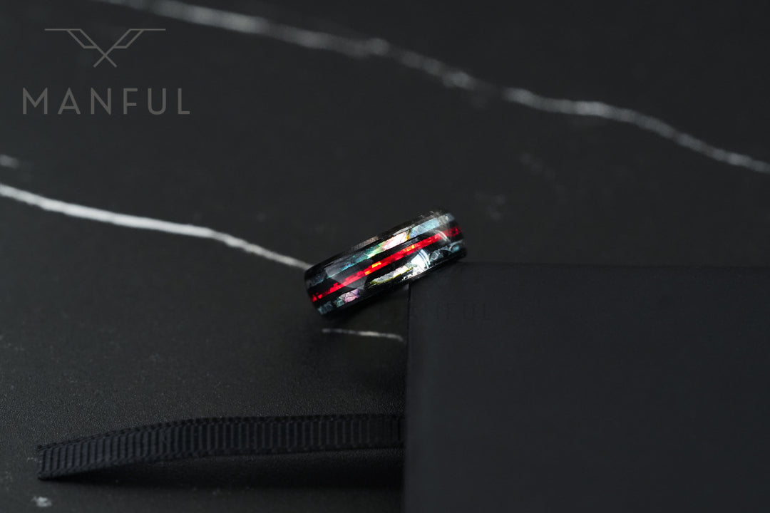 Blaze Crystal Ring, balanced on the edge of a black ring box