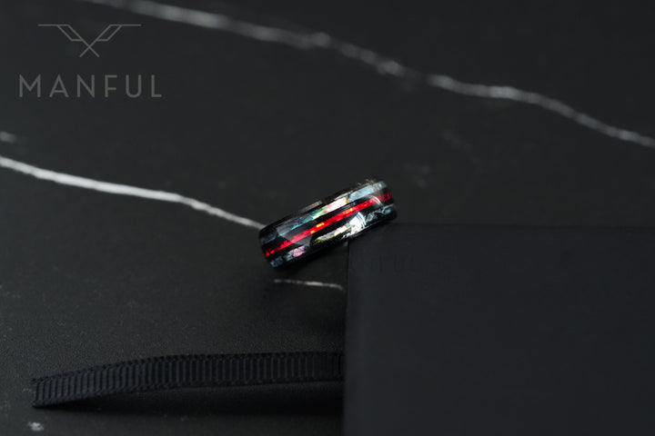 Blaze Crystal Ring, balanced on the edge of a black ring box
