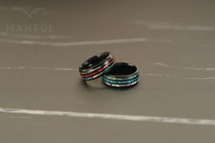 Blaze Crystal Ring, two rings together on a grey marble surface, one lying flat
