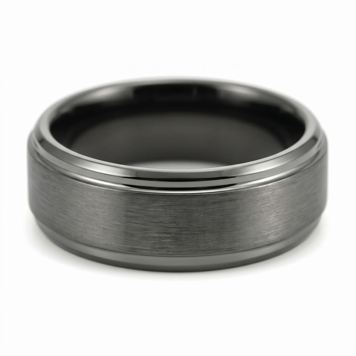 Brushed Tungsten Band (Gunmetal) close up at an angle, lying on its side