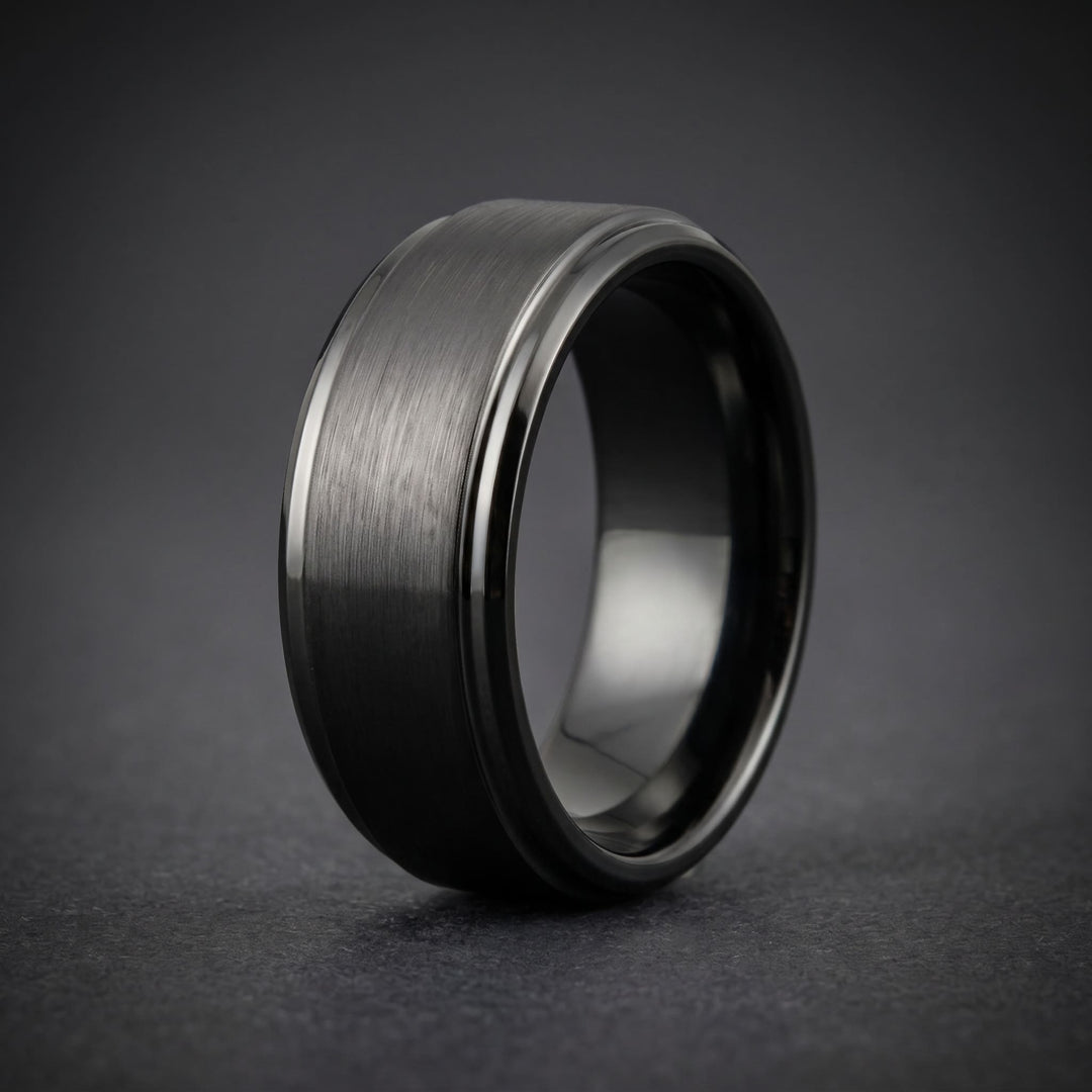 Brushed Tungsten Band (Black) standing upright on matte charcoal