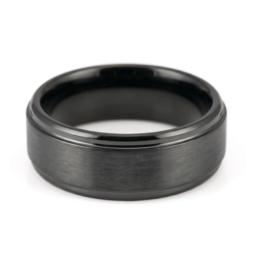 Brushed Tungsten Band (Black) close up at an angle, lying on its side