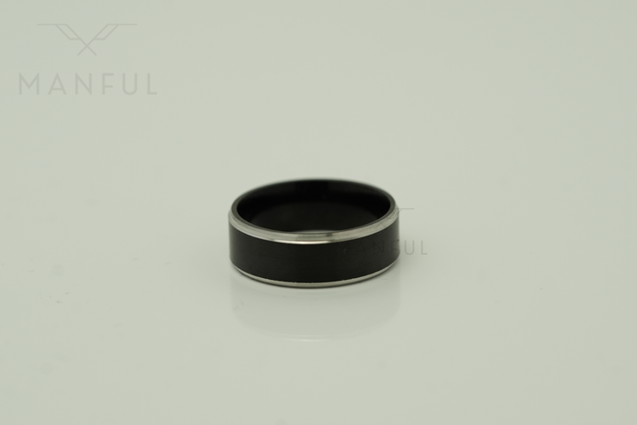 Brushed Tungsten Black & Silver Band, isolated on a plain background in a side-on flat view