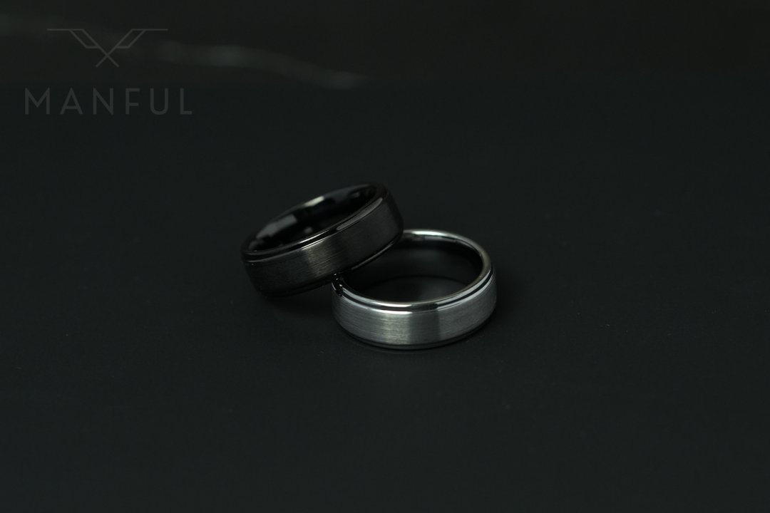 Brushed Tungsten Band Silver, paired with its black colourway on a dark surface