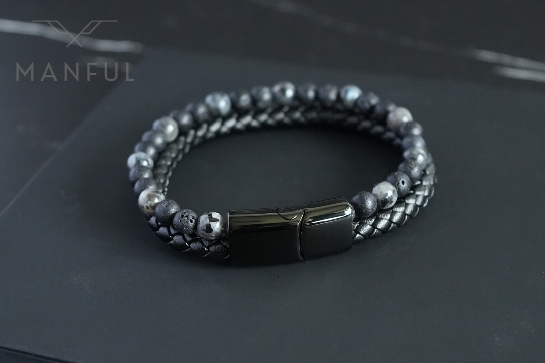 Charcoal Bead And Leather Bracelet, laid on dark slate with the plain black clasp facing forward