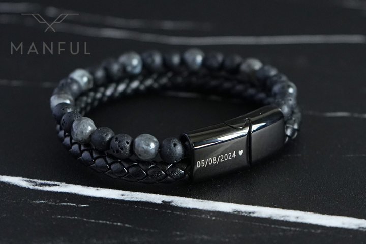 Charcoal Bead And Leather Bracelet, close-up on dark slate showing a date and heart engraved on the clasp