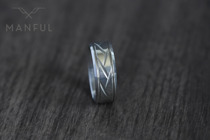 Crosscut Band Silver, standing upright on a dark wood surface with more grain visible in frame