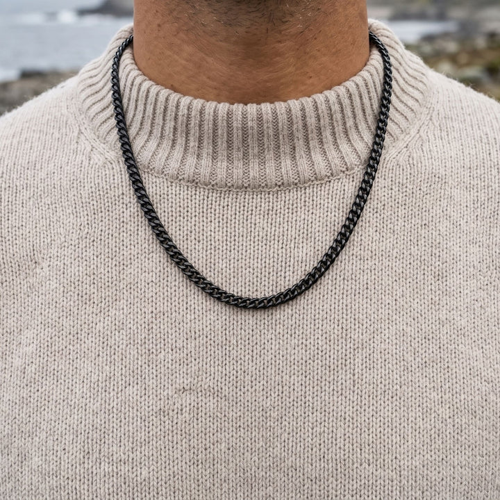Cuban Chain 3mm Black worn over an oatmeal knit jumper by the sea