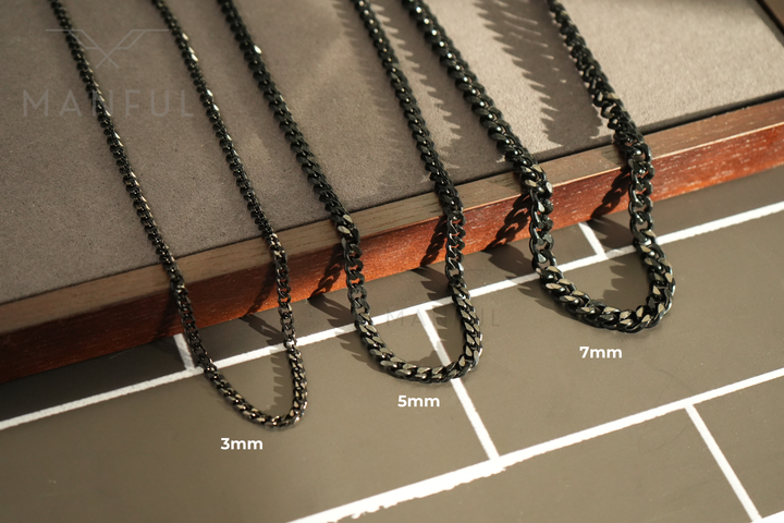 Cuban Chain 3mm Black, three widths draped over a box edge labelled 3mm to 7mm