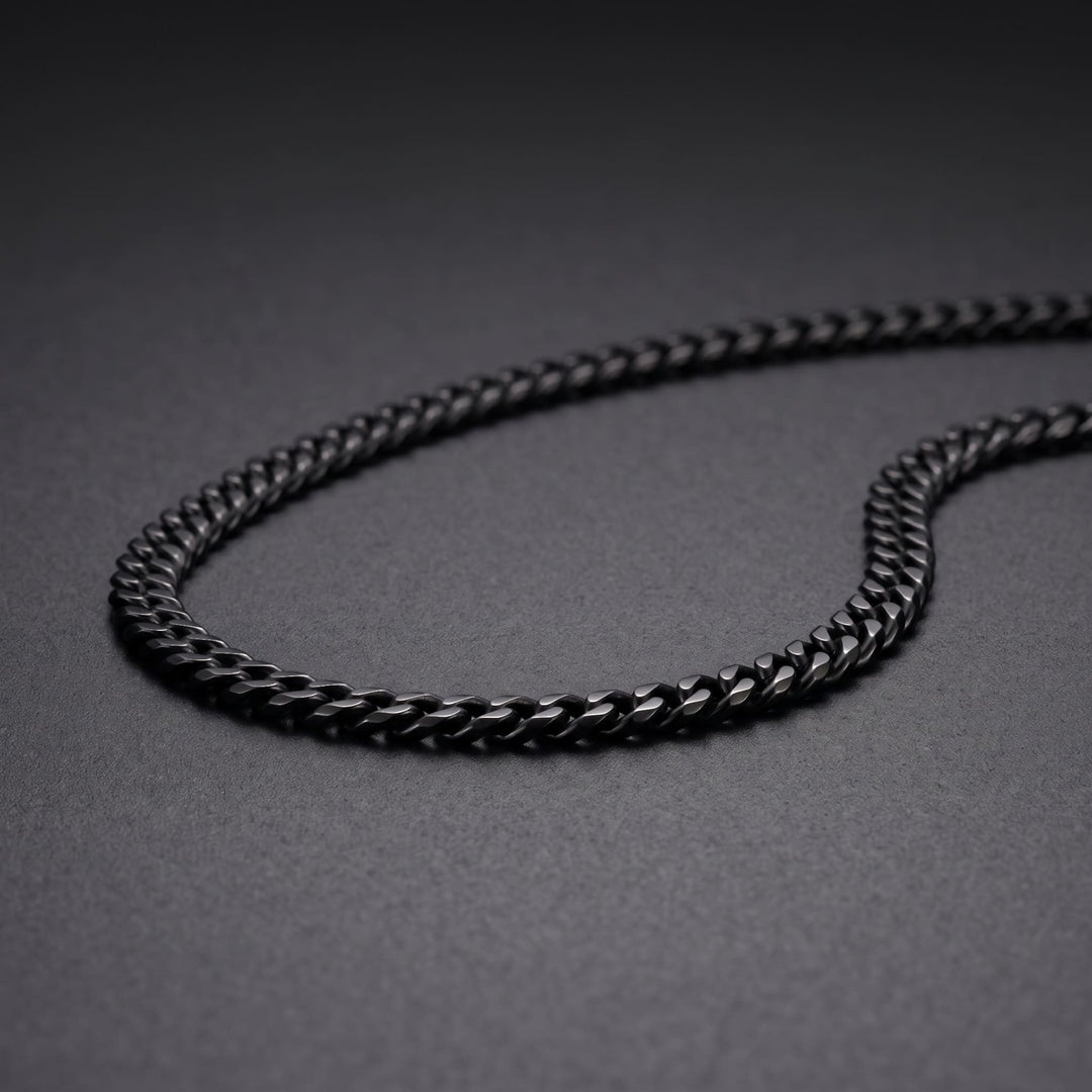 Cuban Chain 3mm Black on matte charcoal, close on the curb links