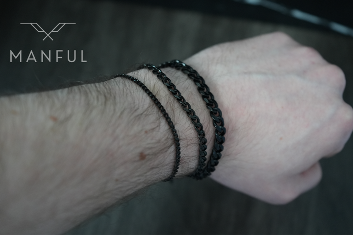 Cuban Chain Bracelet Black, worn stacked on a man's wrist