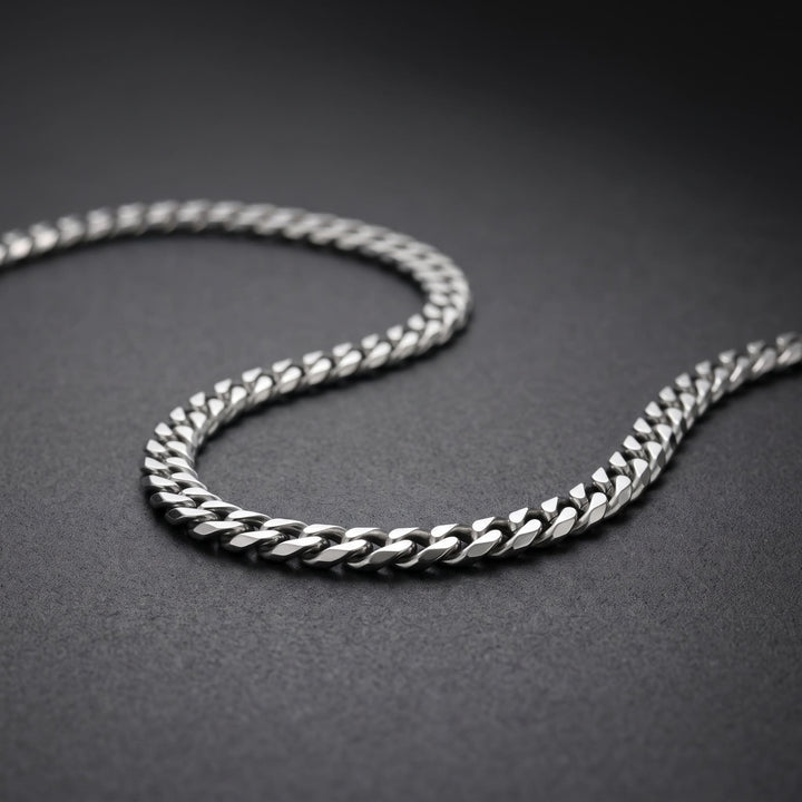 Cuban Chain 5mm Silver on matte charcoal, close on the curb links