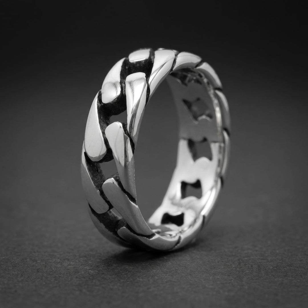 Cuban Chain Ring (Silver) standing upright on matte charcoal