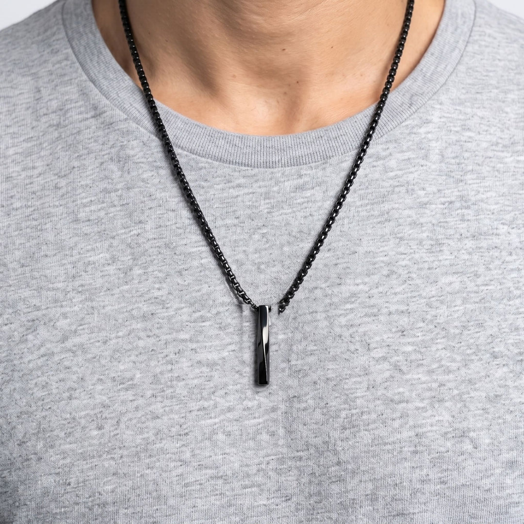 Cuboid Pendant Chain (Black) on a man's chest over a grey t-shirt