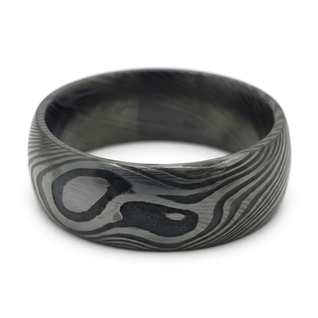 Damascus Steel Band (Black) close up at an angle, lying on its side