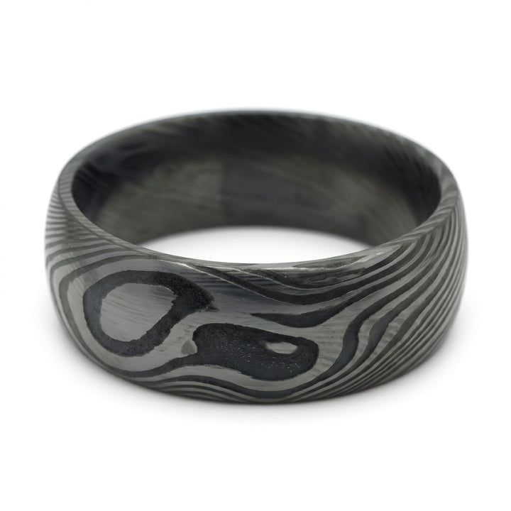 Damascus Steel Band (Black) close up at an angle, lying on its side