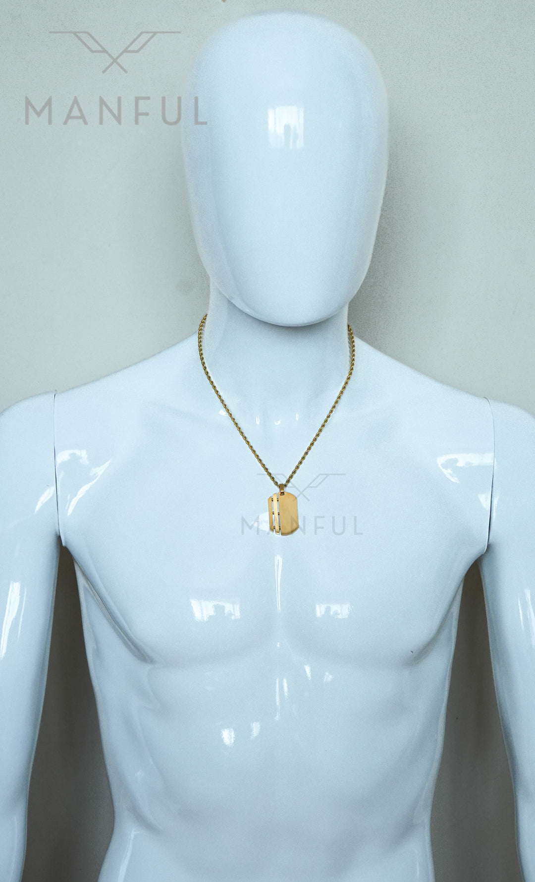 Dog Tag Chain Gold, worn around the neck of a white mannequin torso