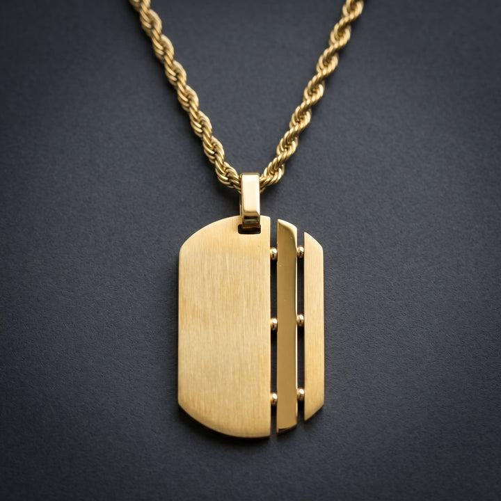 Dog Tag Chain (Gold) against a dark charcoal backdrop