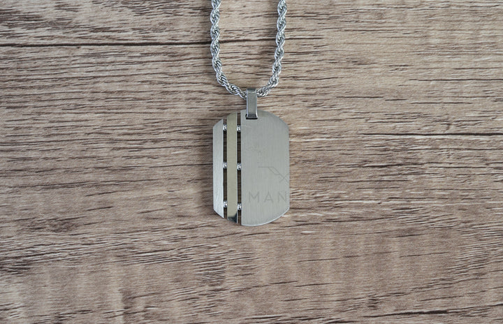 Dog Tag Chain Silver, resting flat on a wood-grain surface