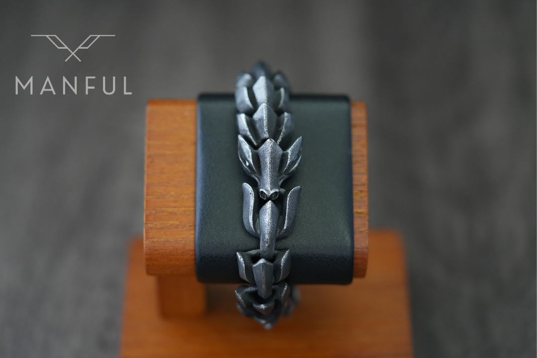 Dragon Link Bracelet Black, wrapped around a wrist display stand facing the camera