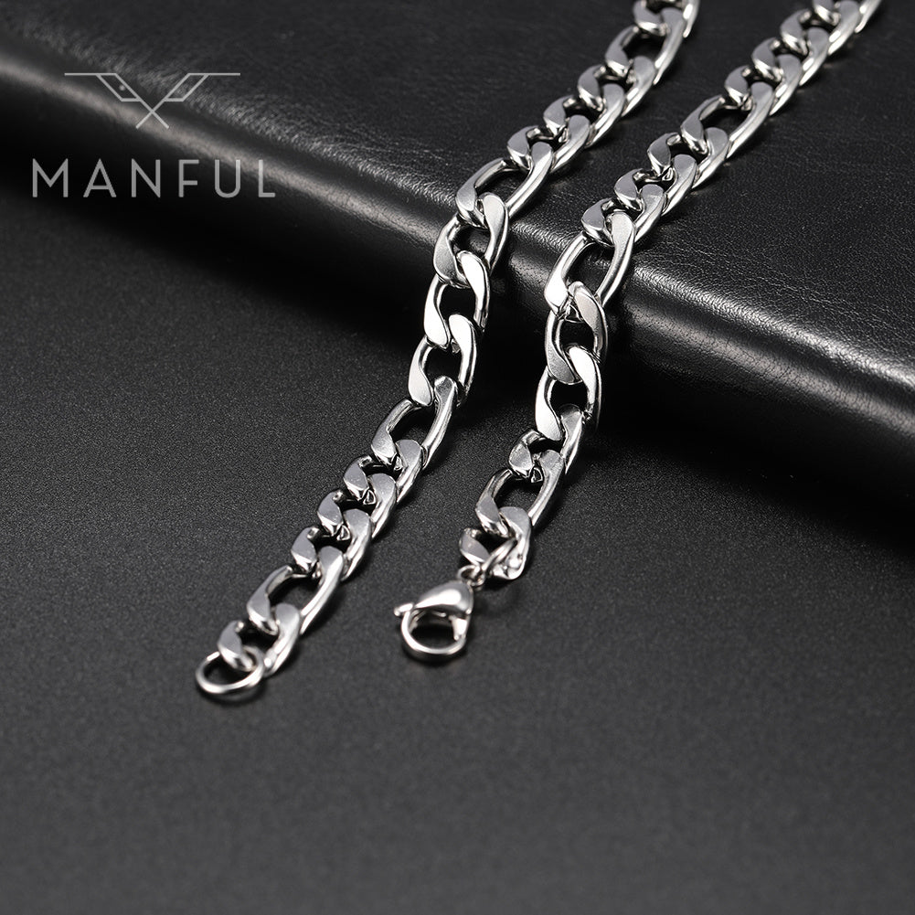 Figaro Chain 7mm Silver, two lengths shown on a dark leather surface