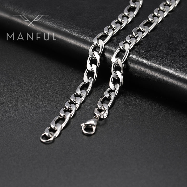 Figaro Chain 7mm Silver, two lengths shown on a dark leather surface