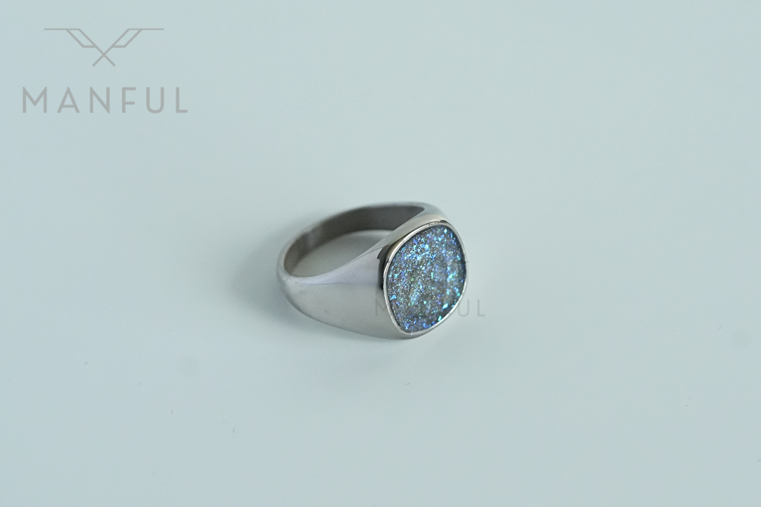 Galaxy Signet Ring, tilted view on a light grey background
