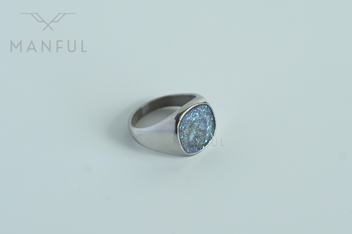 Galaxy Signet Ring, tilted view on a light grey background