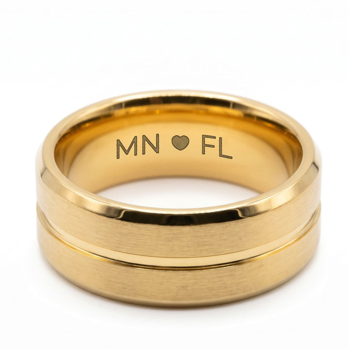 Gold Band engraving example: MN, a heart and FL engraved inside the band