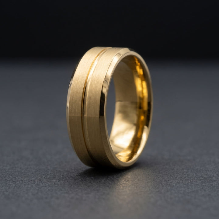 Gold Band standing on a dark charcoal surface