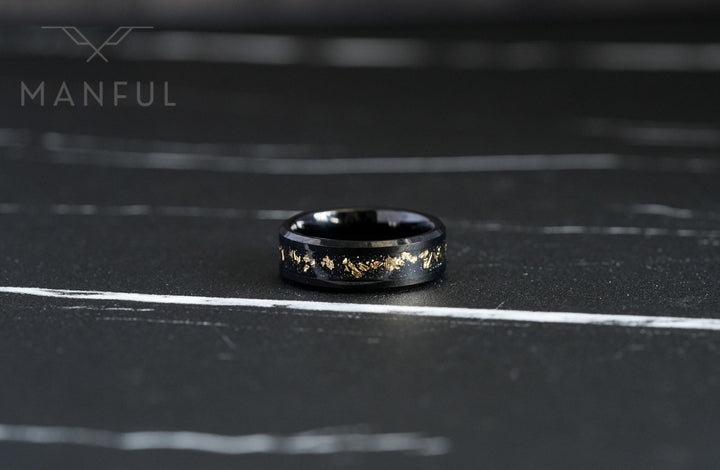 Gold Leaf Inlay Band Black, lying flat and face-on on a dark marble surface