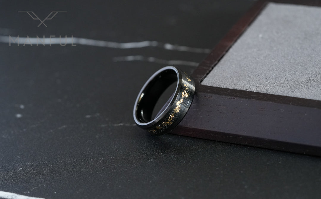 Gold Leaf Inlay Band Black, close-up leaning against a wooden block corner