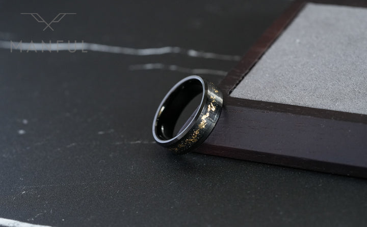Gold Leaf Inlay Band Black, close-up leaning against a wooden block corner