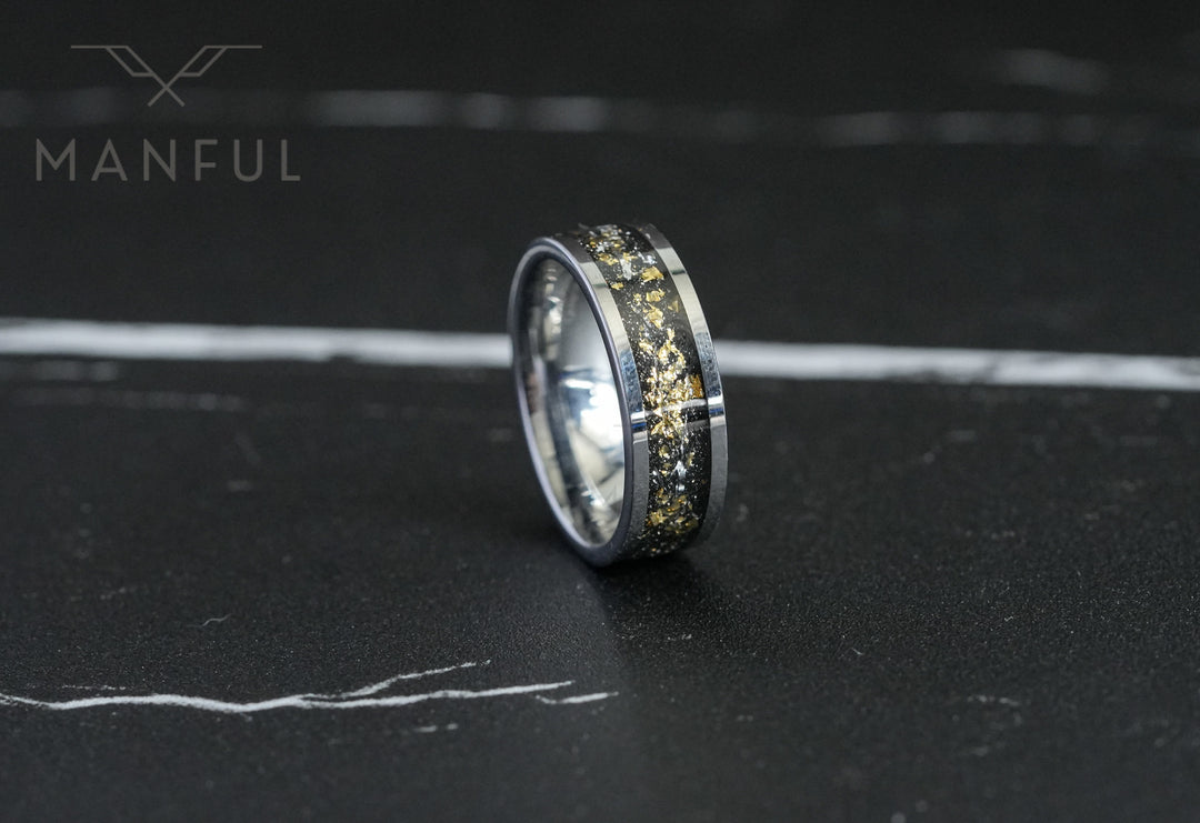 Gold Leaf Inlay Band Silver, standing upright on a dark marble surface