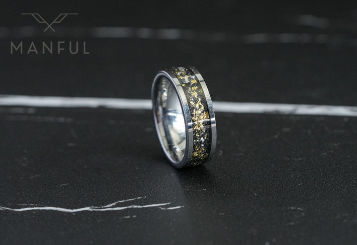 Gold Leaf Inlay Band Silver, standing upright on a dark marble surface