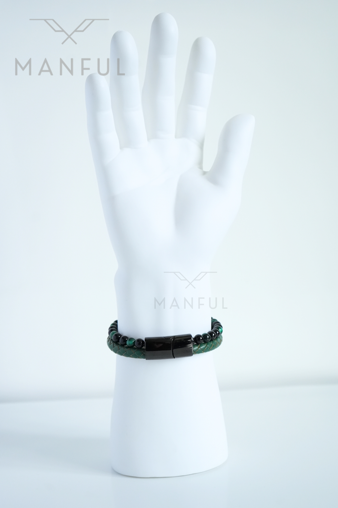 Jade Bead And Leather Bracelet, worn on a mannequin wrist with the clasp facing the camera
